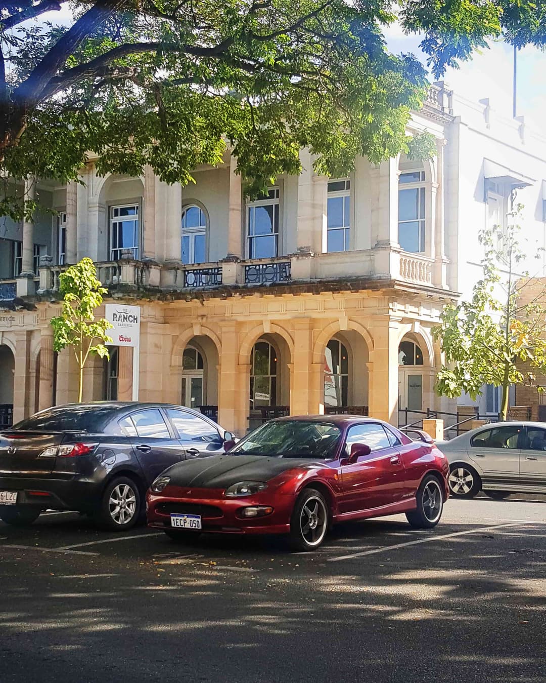 Portrait photo of a maroon Mitsubishi FTO